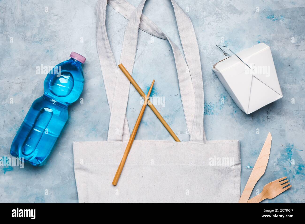 Eco bag with bottle of water and box for food on color background Stock Photo