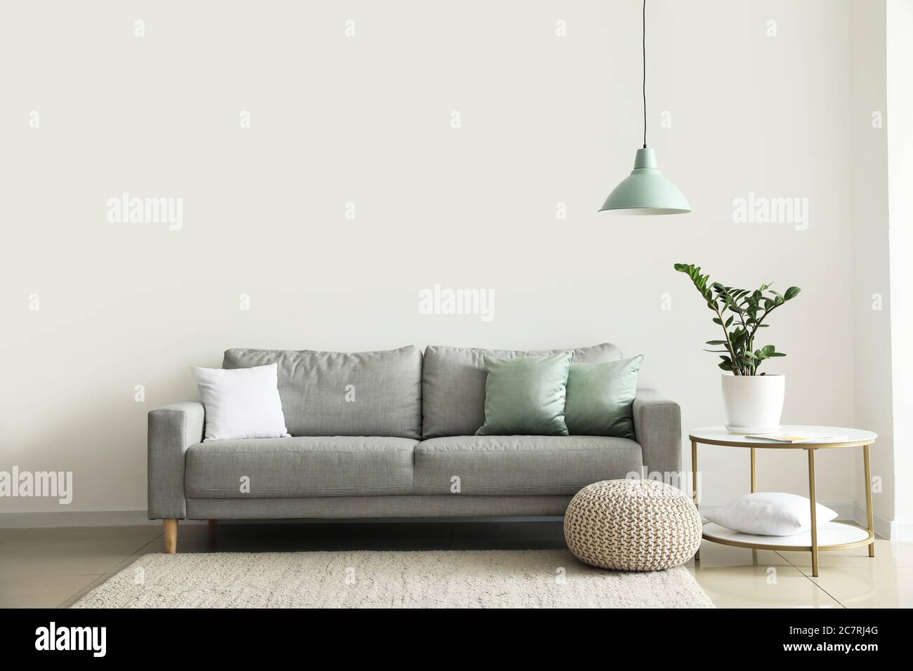 Interior of modern room with comfortable sofa Stock Photo - Alamy