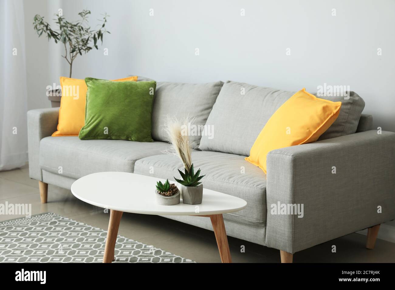 Interior of modern room with comfortable sofa Stock Photo - Alamy