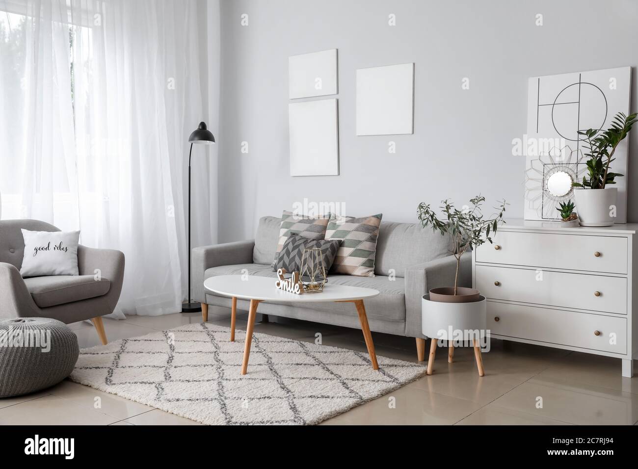 Interior of modern room with comfortable sofa Stock Photo - Alamy