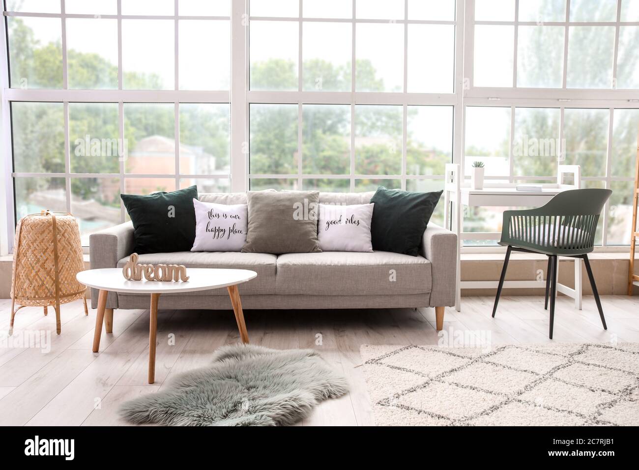 Interior of modern room with comfortable sofa Stock Photo - Alamy