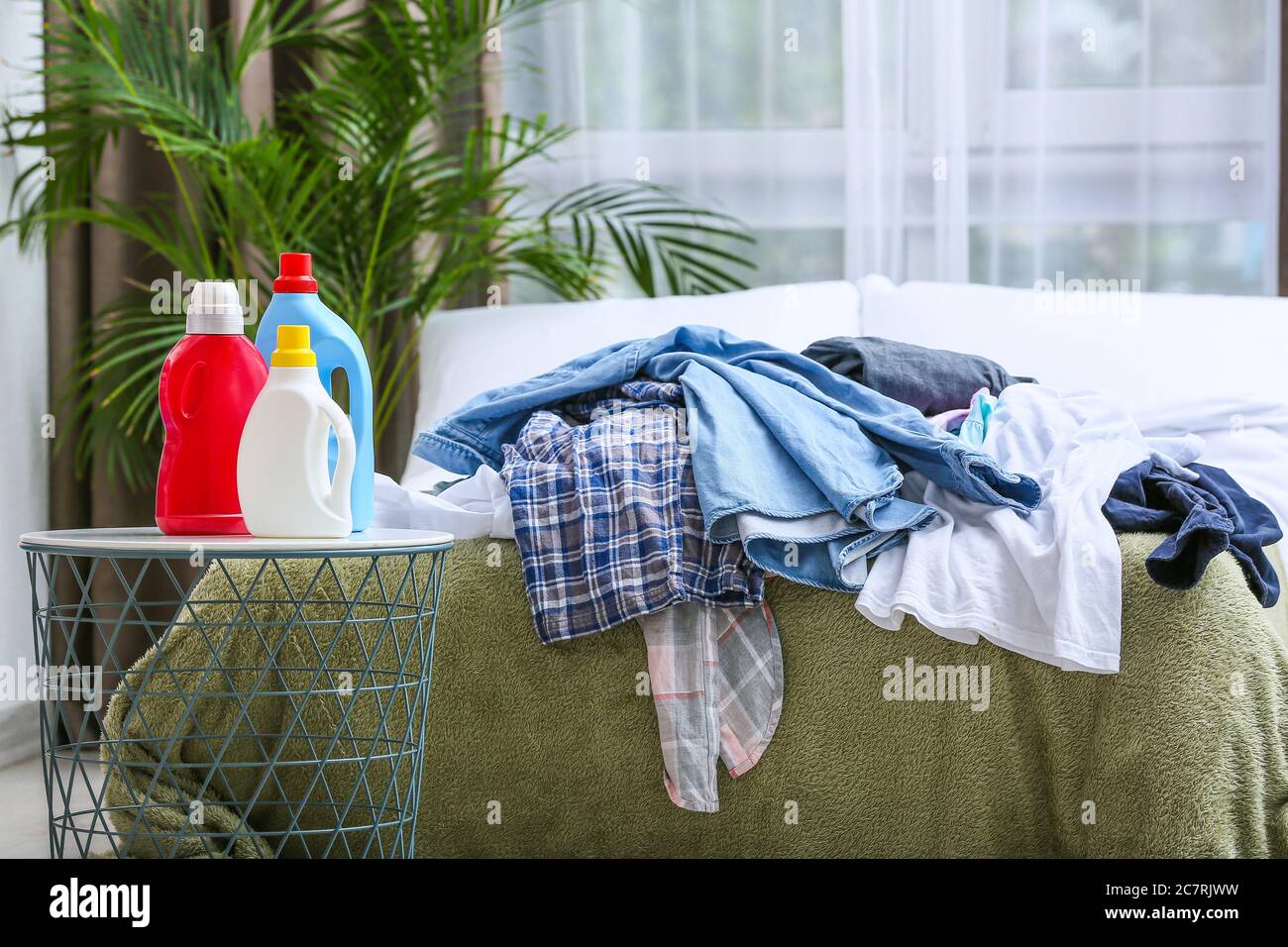 Detergents and dirty clothes in bedroom Stock Photo Alamy