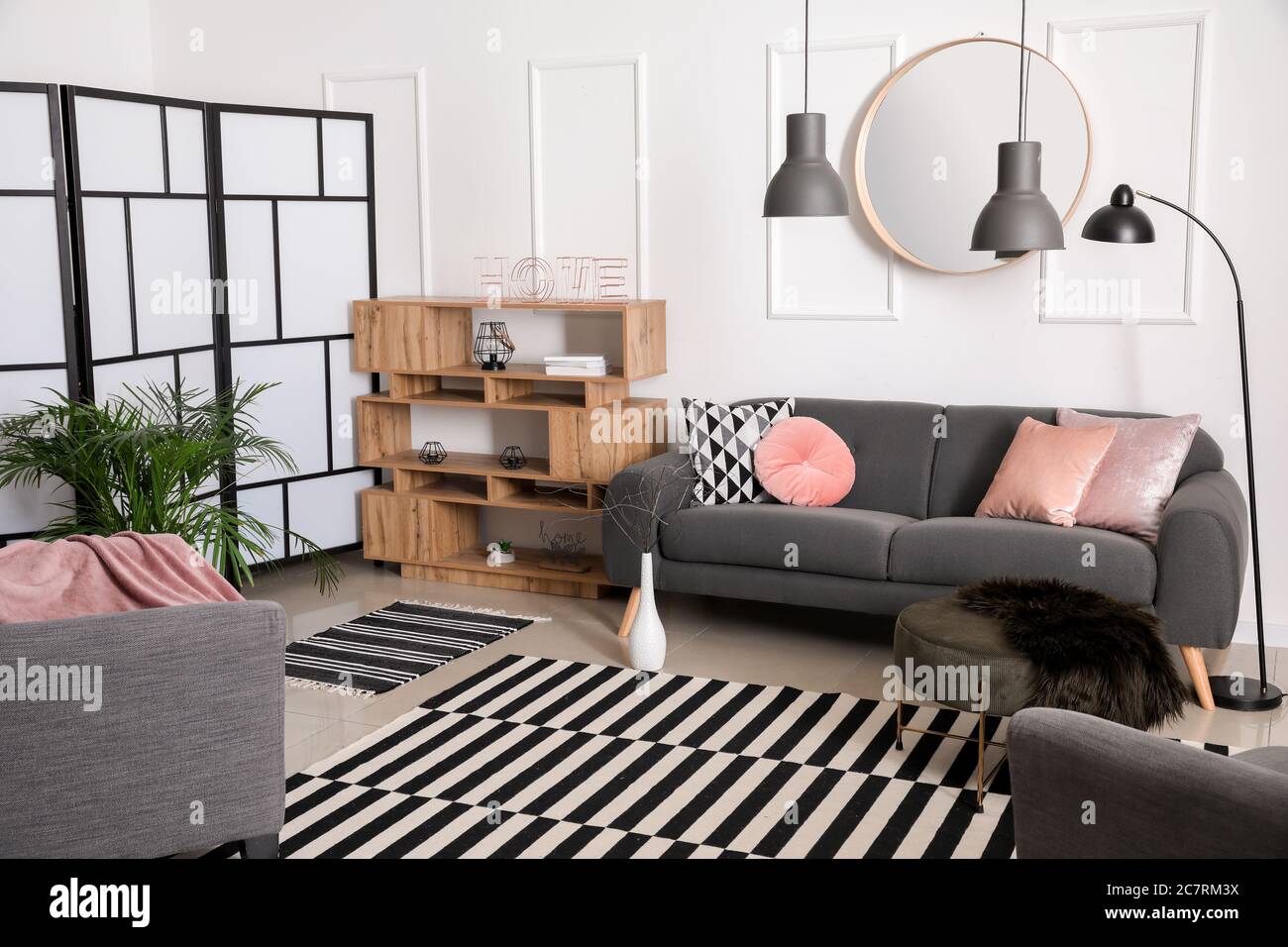 Stylish interior of living room with comfortable sofa Stock Photo - Alamy
