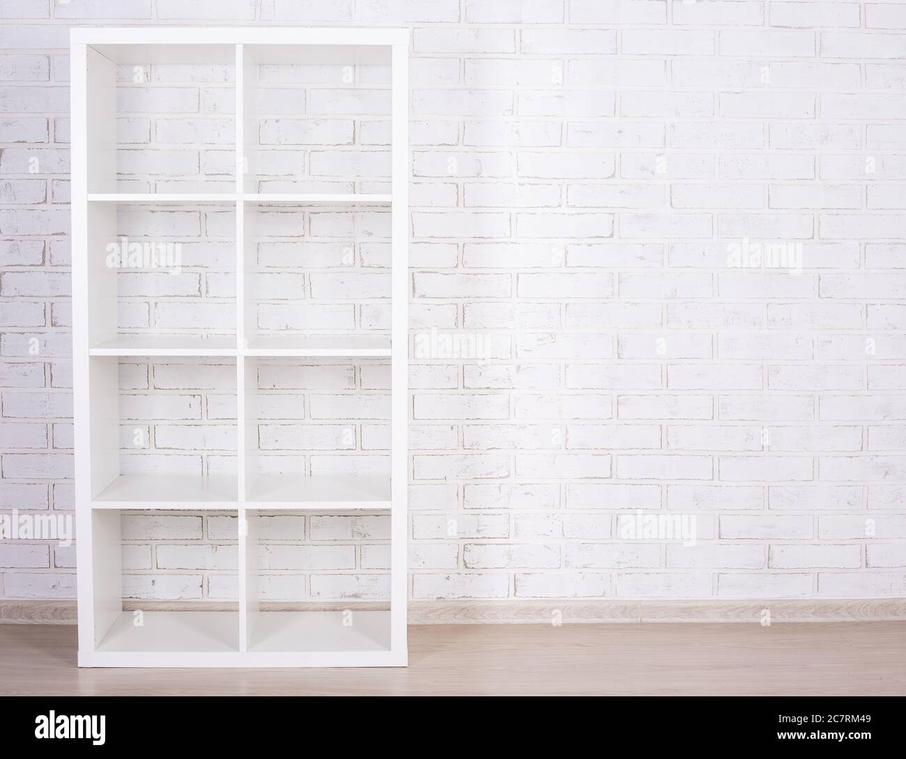 white wooden shelf over white brick wall Stock Photo - Alamy