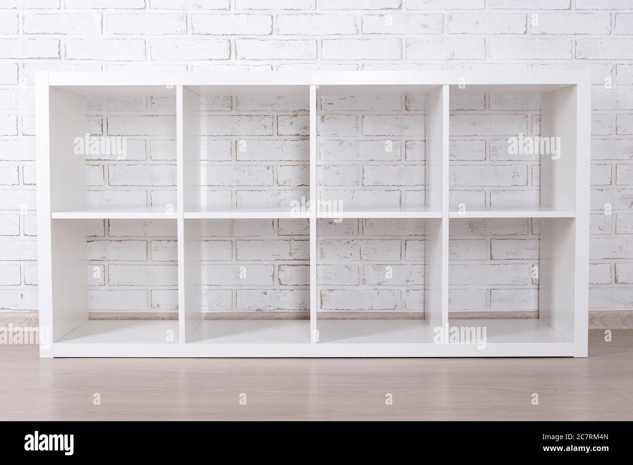 modern wooden shelf over white brick wall background Stock Photo - Alamy