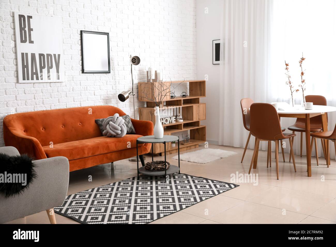 Stylish interior of living room with comfortable sofa Stock Photo - Alamy