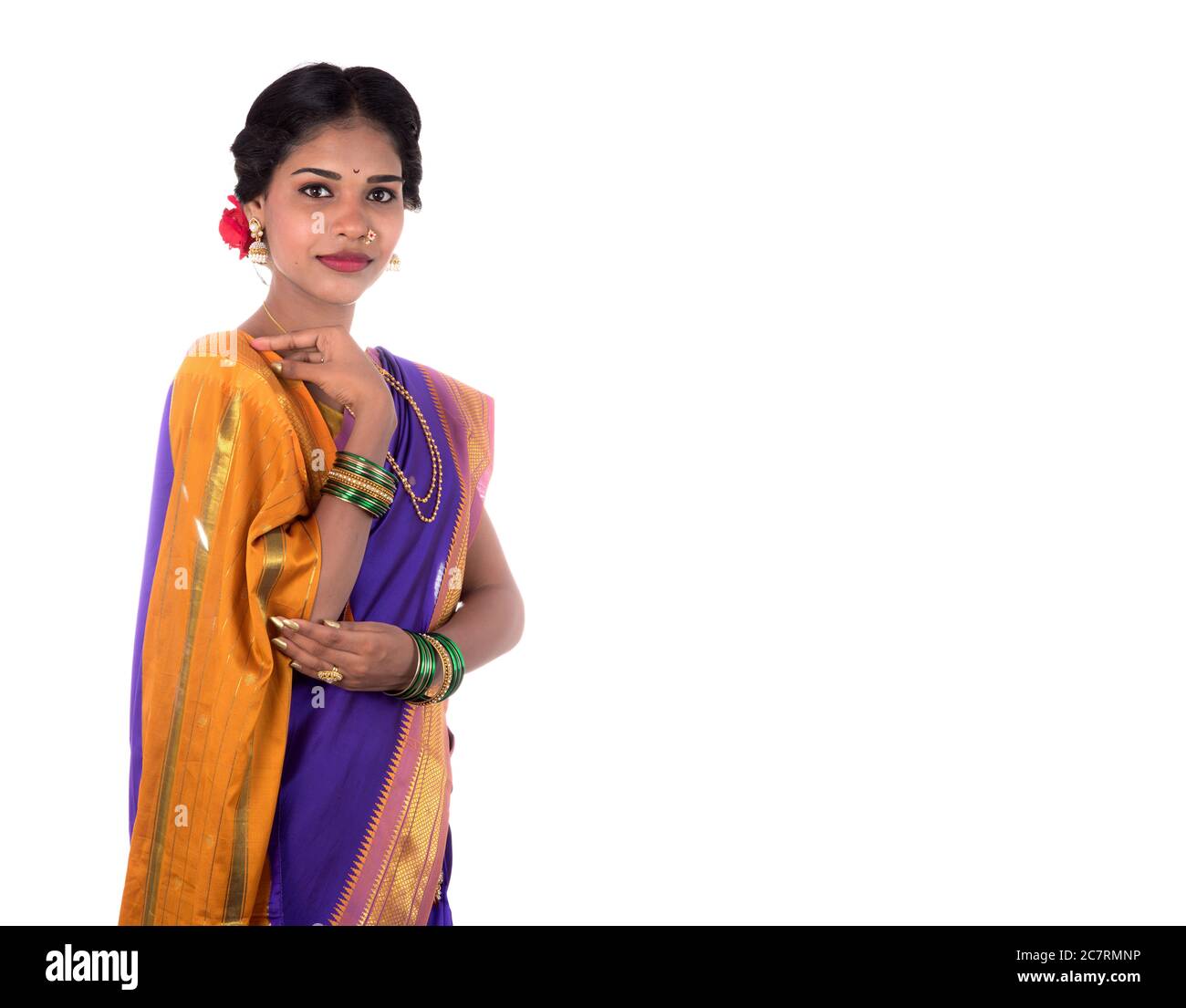 beautiful indian young girl posing in traditional indian saree on white background 2C7RMNP