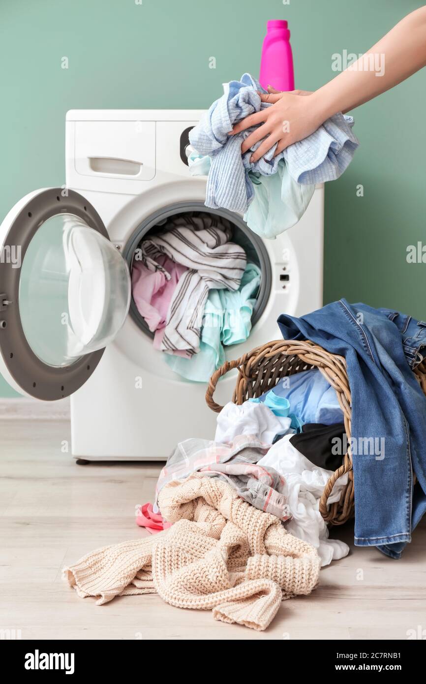 Woman laundry machine smell hi-res stock photography and images - Alamy