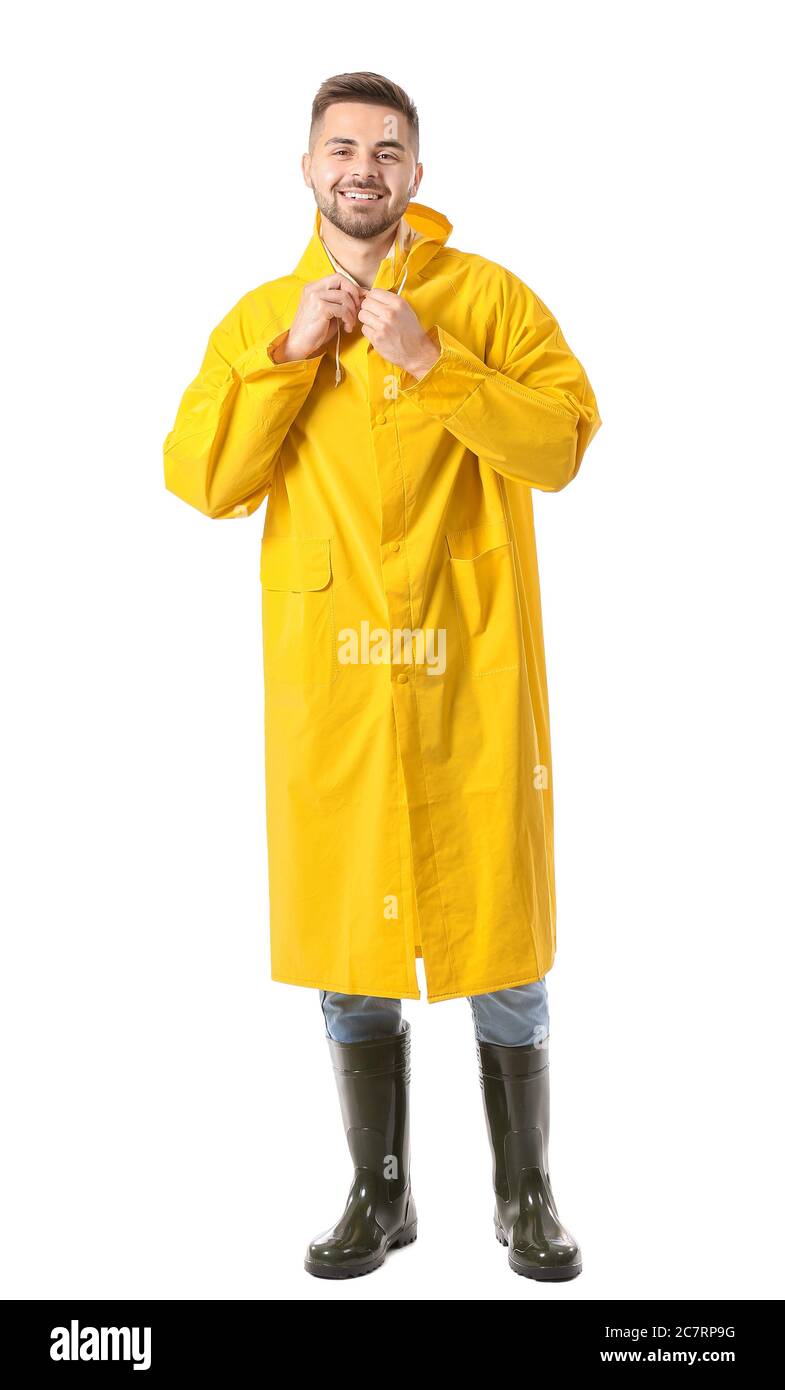 Young man in raincoat on white background Stock Photo - Alamy