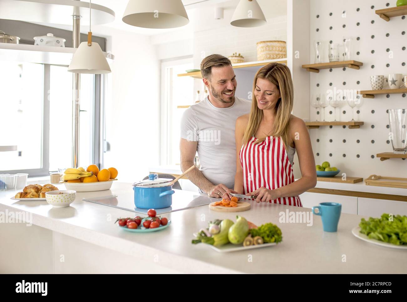 Adorable cooking something in the kitchen with each other Stock Photo ...