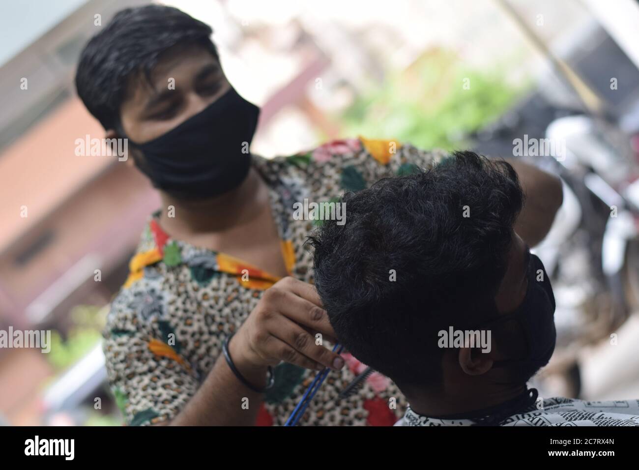 Hyderabad, Telangana, India. june292020 A hairdresser, wearing a