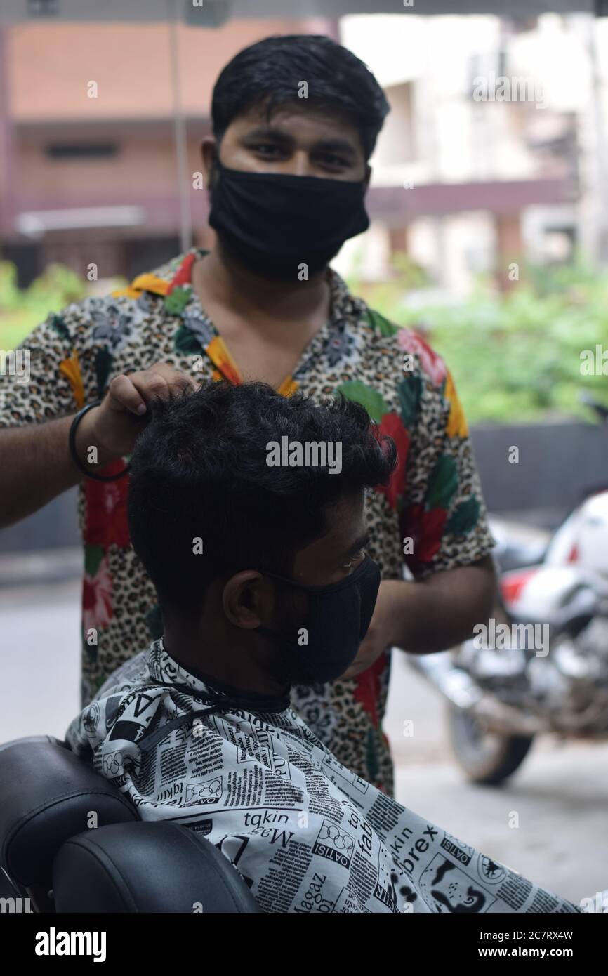 Hyderabad, Telangana, India. june292020 A hairdresser, wearing a