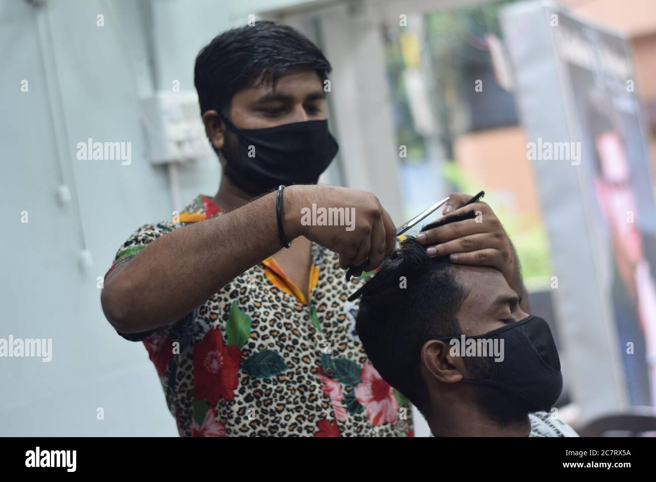 Hyderabad, Telangana, India. june292020 A hairdresser, wearing a