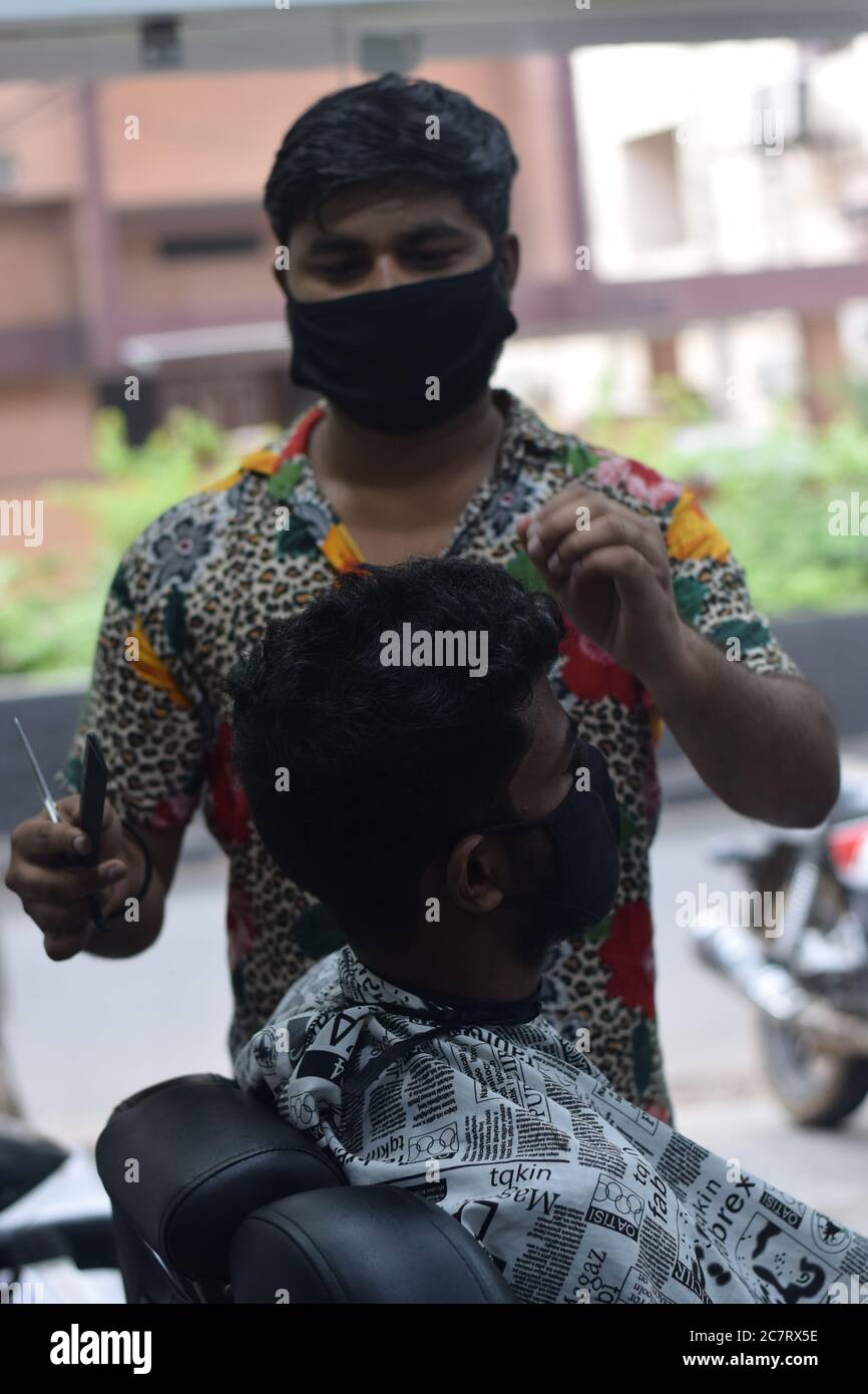 Hyderabad, Telangana, India. june292020 A hairdresser, wearing a