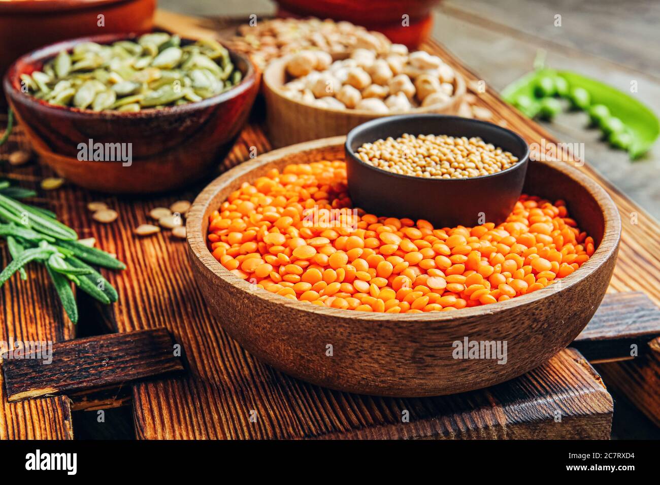 Bowl with lentils and spices on table Stock Photo