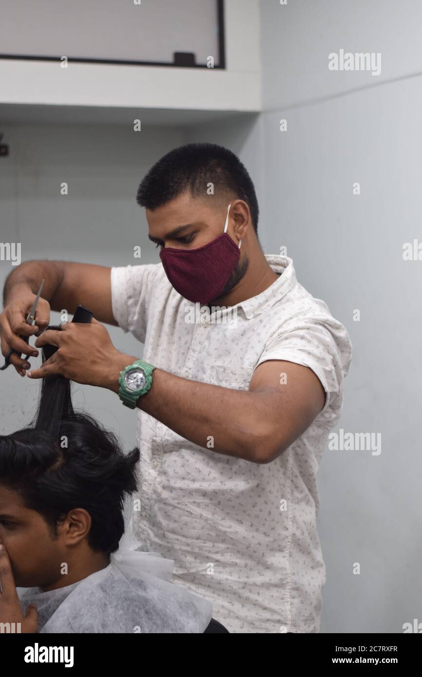 Hyderabad, Telangana, India. june292020 A hairdresser, wearing a