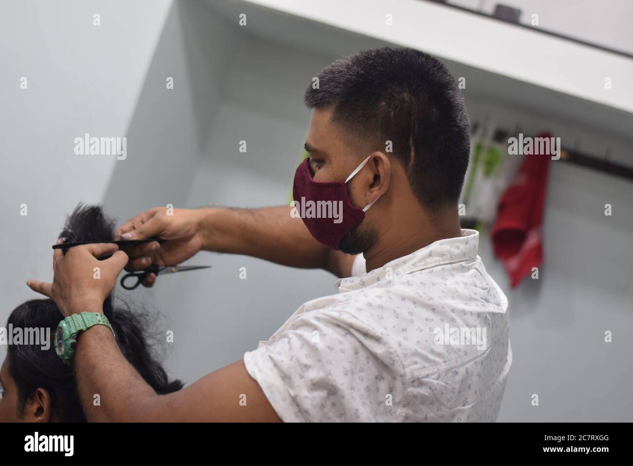 Hyderabad, Telangana, India. june292020 A hairdresser, wearing a