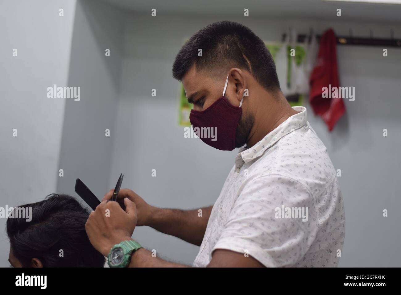 Hyderabad, Telangana, India. june292020 A hairdresser, wearing a