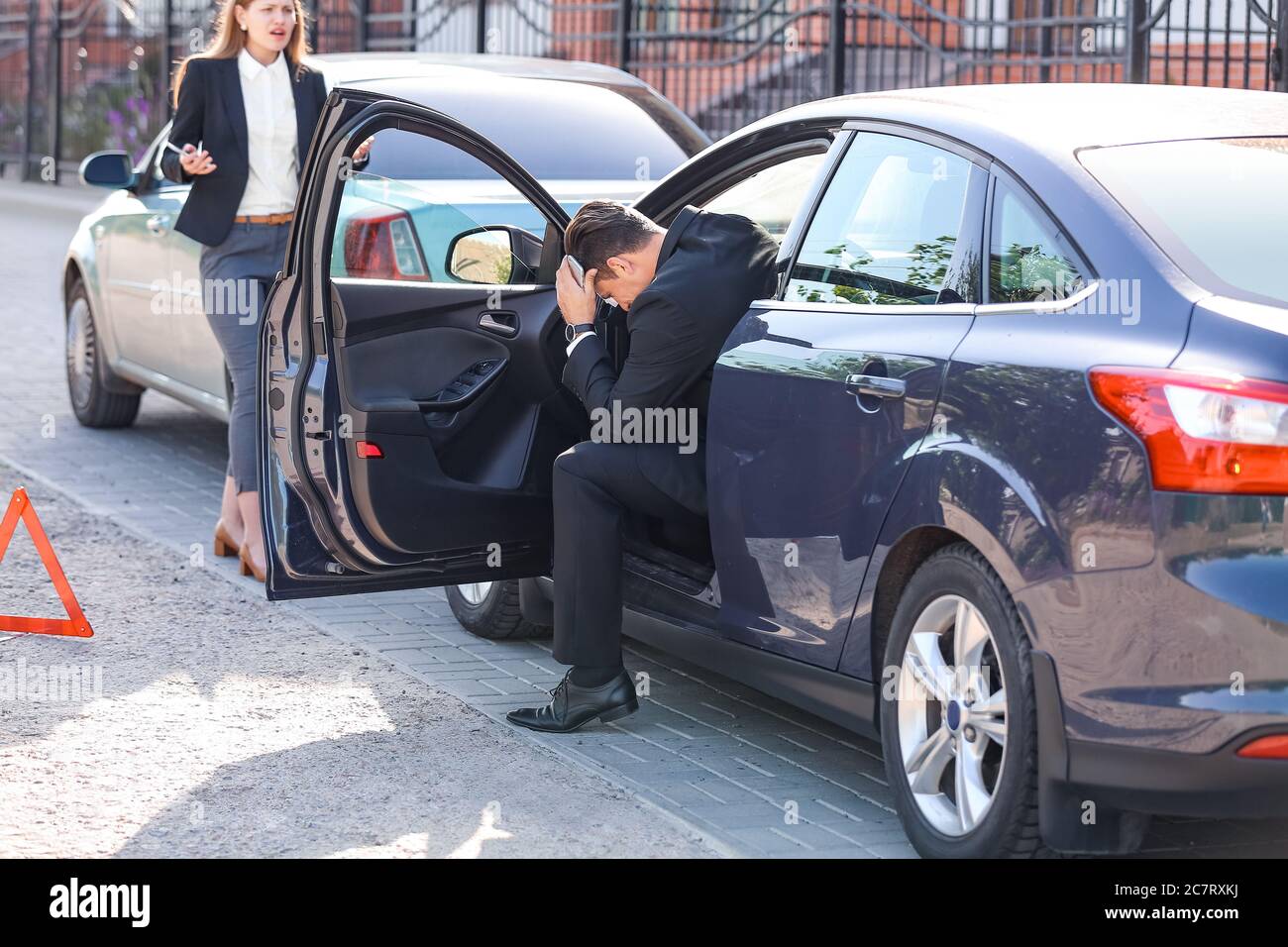Stressed drivers after car accident on road Stock Photo - Alamy