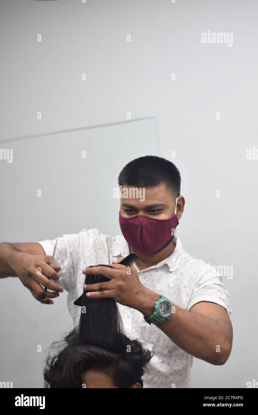 Hyderabad, Telangana, India. june292020 A hairdresser, wearing a