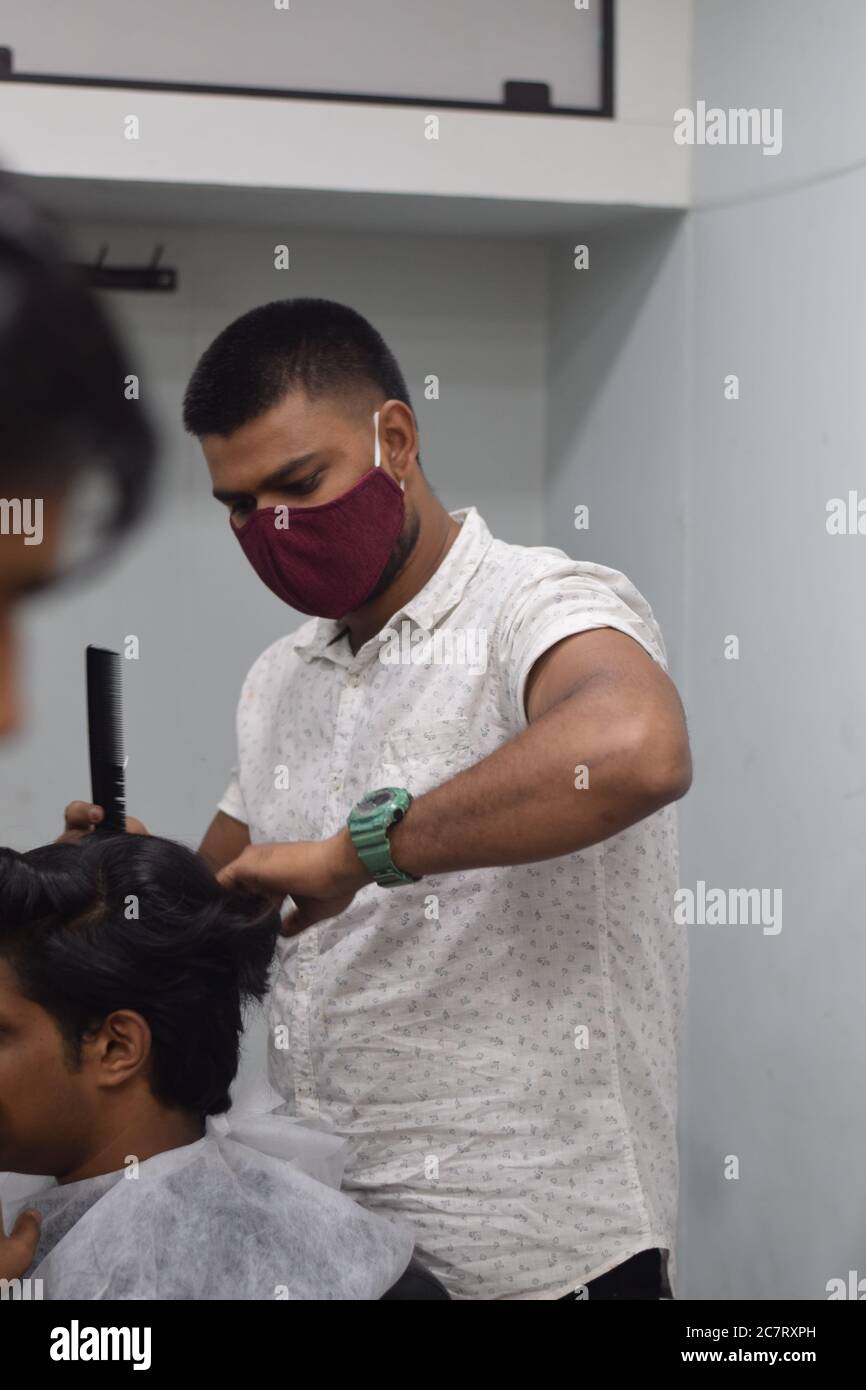 Hyderabad, Telangana, India. june292020 A hairdresser, wearing a