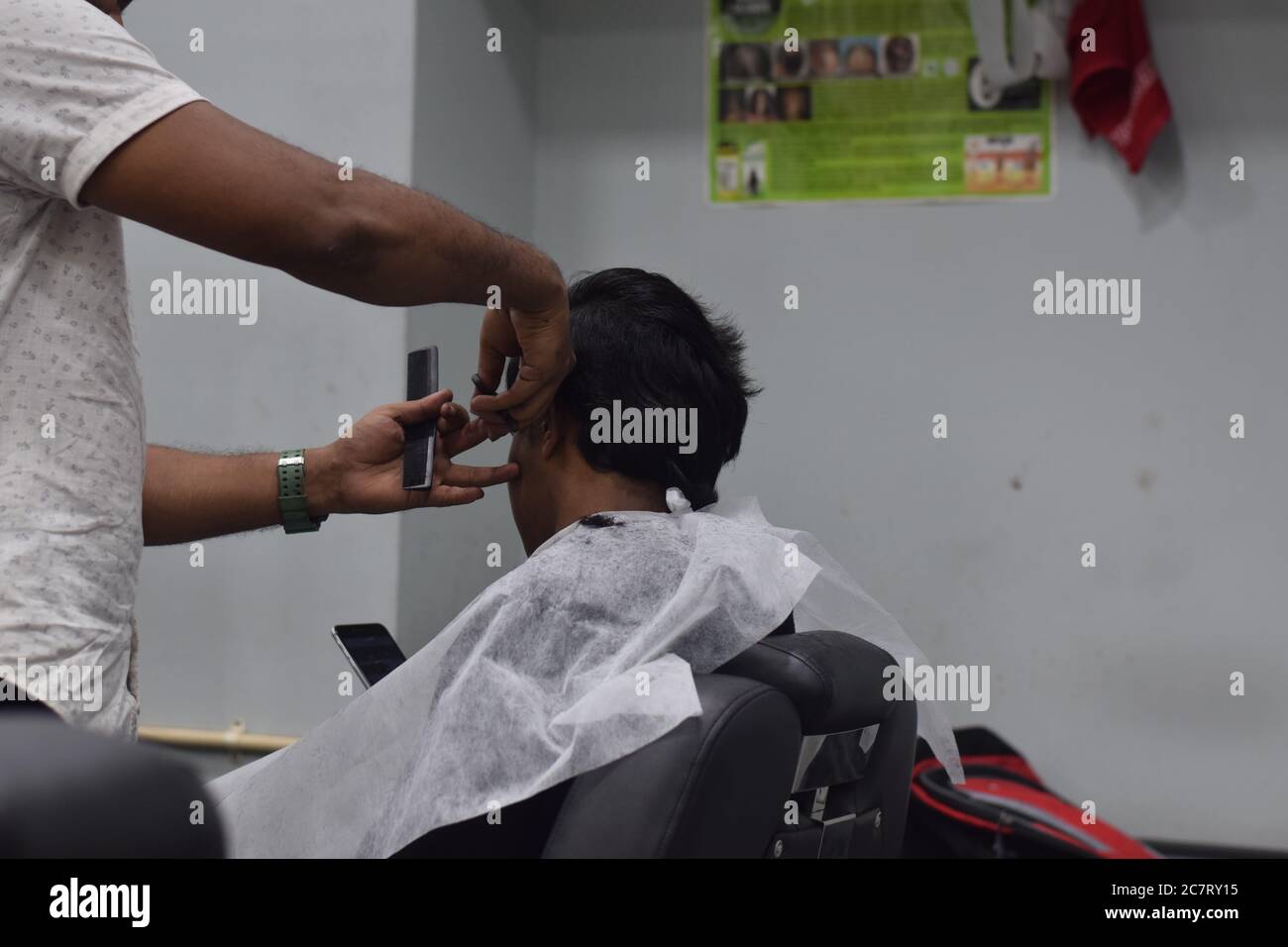 Hyderabad, Telangana, India. june292020 A hairdresser, wearing a
