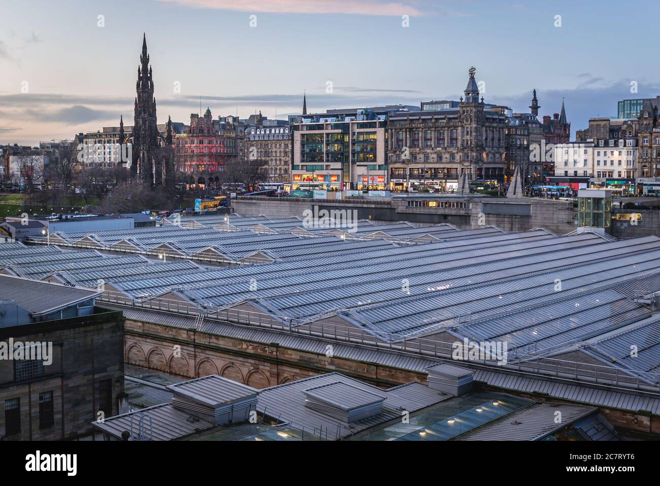 Aerial view with roofs of Waverley Mall and Waverley railway station in Edinburgh, capital of Scotland, part of UK, Princes Street on background Stock Photo