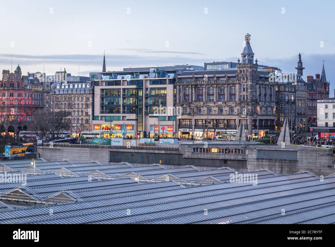 Aerial view with roofs of Waverley Mall and Waverley railway station in Edinburgh, capital of Scotland, part of UK, Princes Street on background Stock Photo
