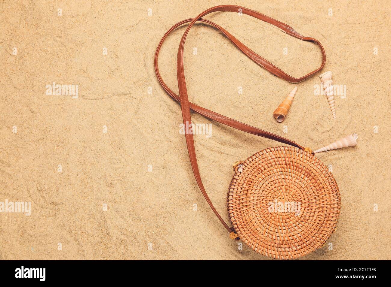 Stylish female bag on sand background Stock Photo