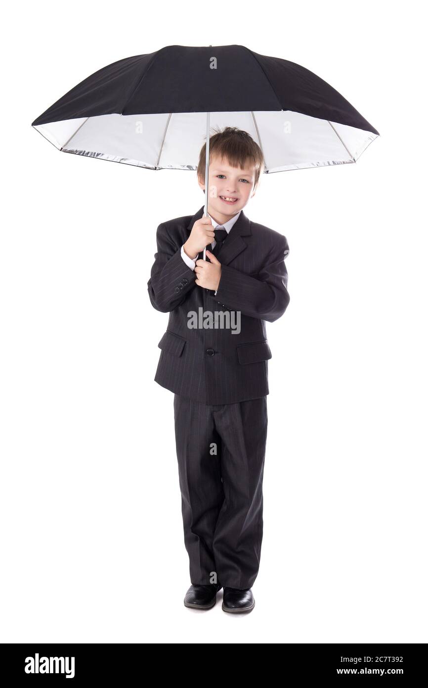 cute little boy in business suit with umbrella isolated on white