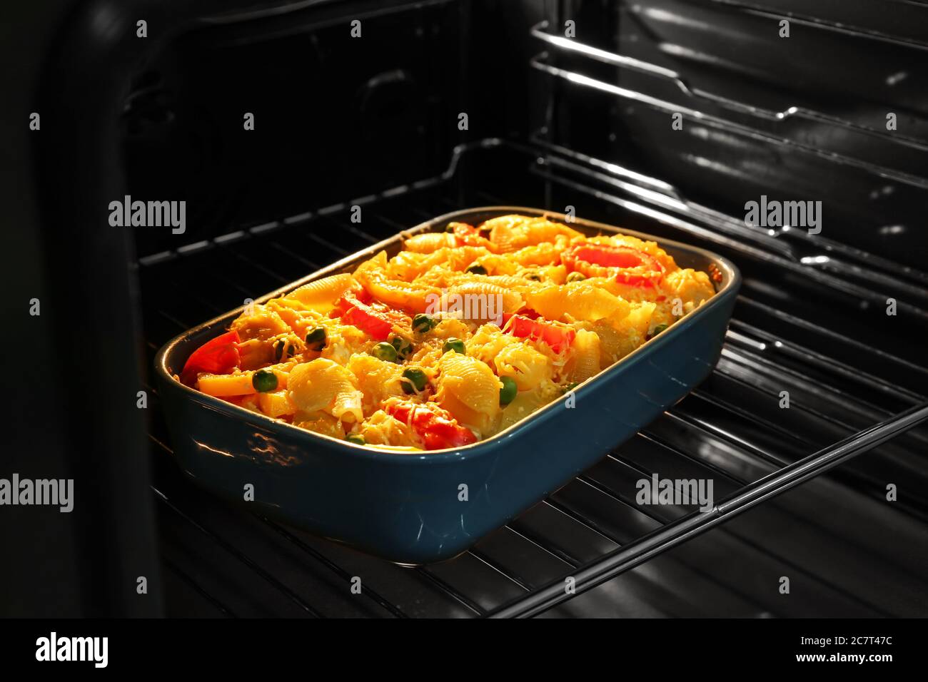 Baking of tasty pasta in oven Stock Photo Alamy