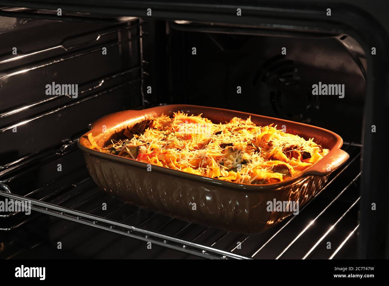 Baking of tasty pasta in oven Stock Photo Alamy