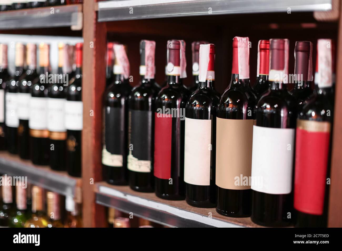 Rack with bottles of wine in store Stock Photo Alamy