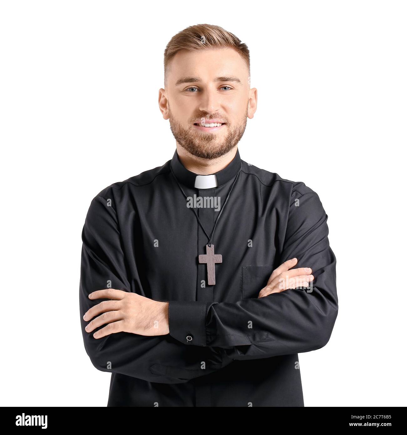 Handsome young priest on white background Stock Photo - Alamy