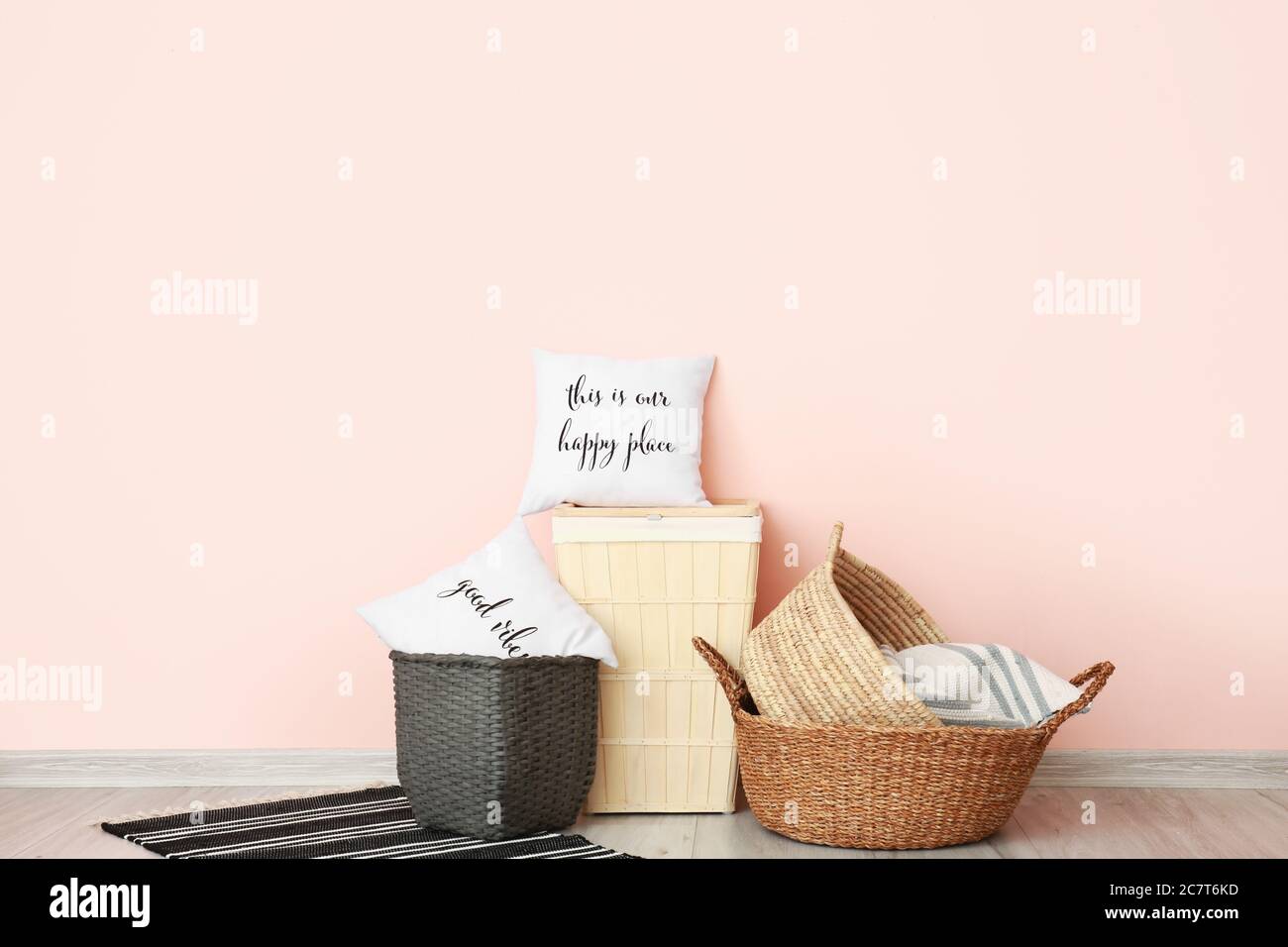Baskets with pillows in room Stock Photo Alamy