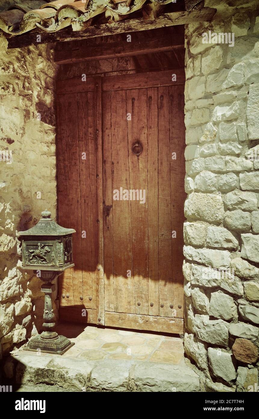 Medieval wooden door in Bonnieux village, Provence, France. Filtered ...
