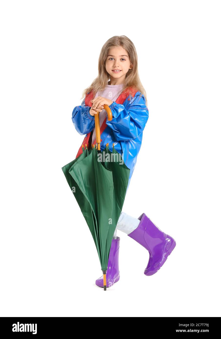Cute little girl in raincoat and with umbrella on white background