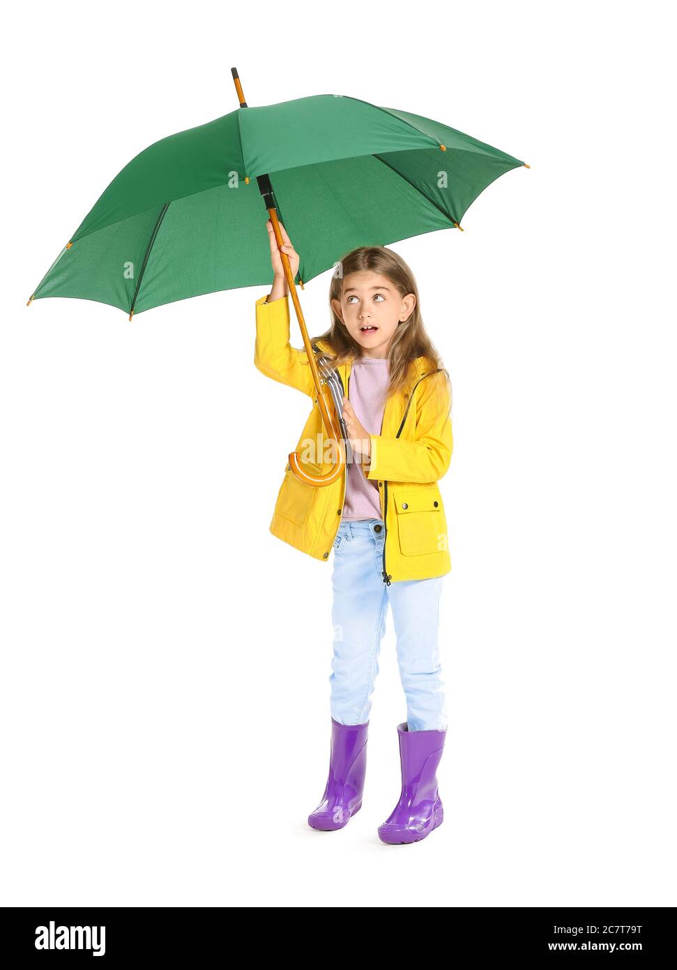 Cute little girl in raincoat and with umbrella on white background