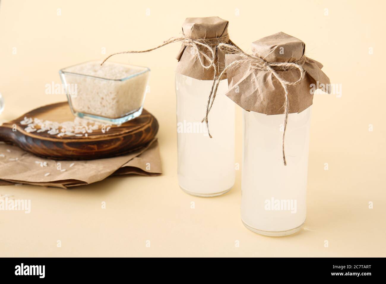 Bottles of rice water on color background Stock Photo Alamy