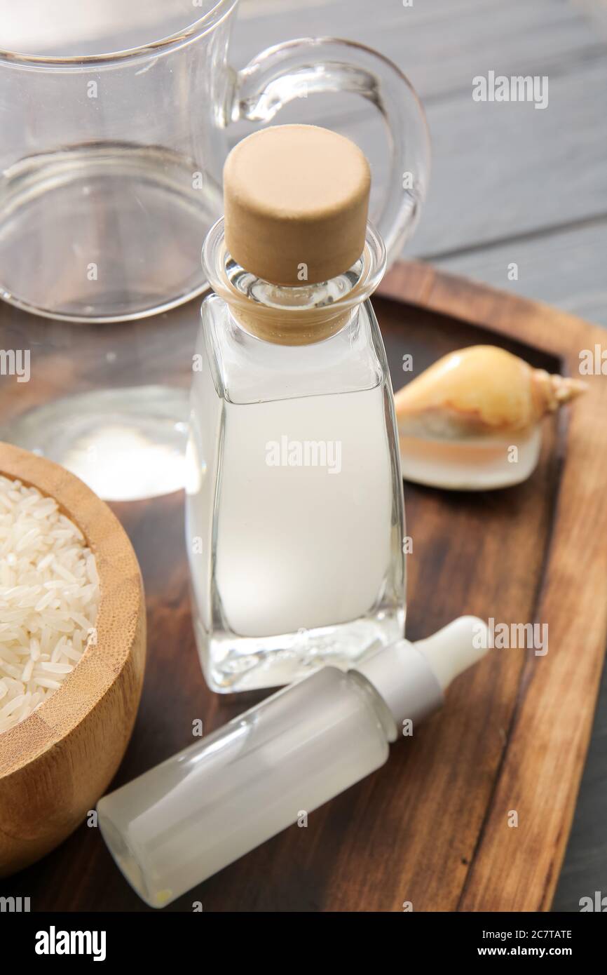 Bottles of rice water on table Stock Photo Alamy