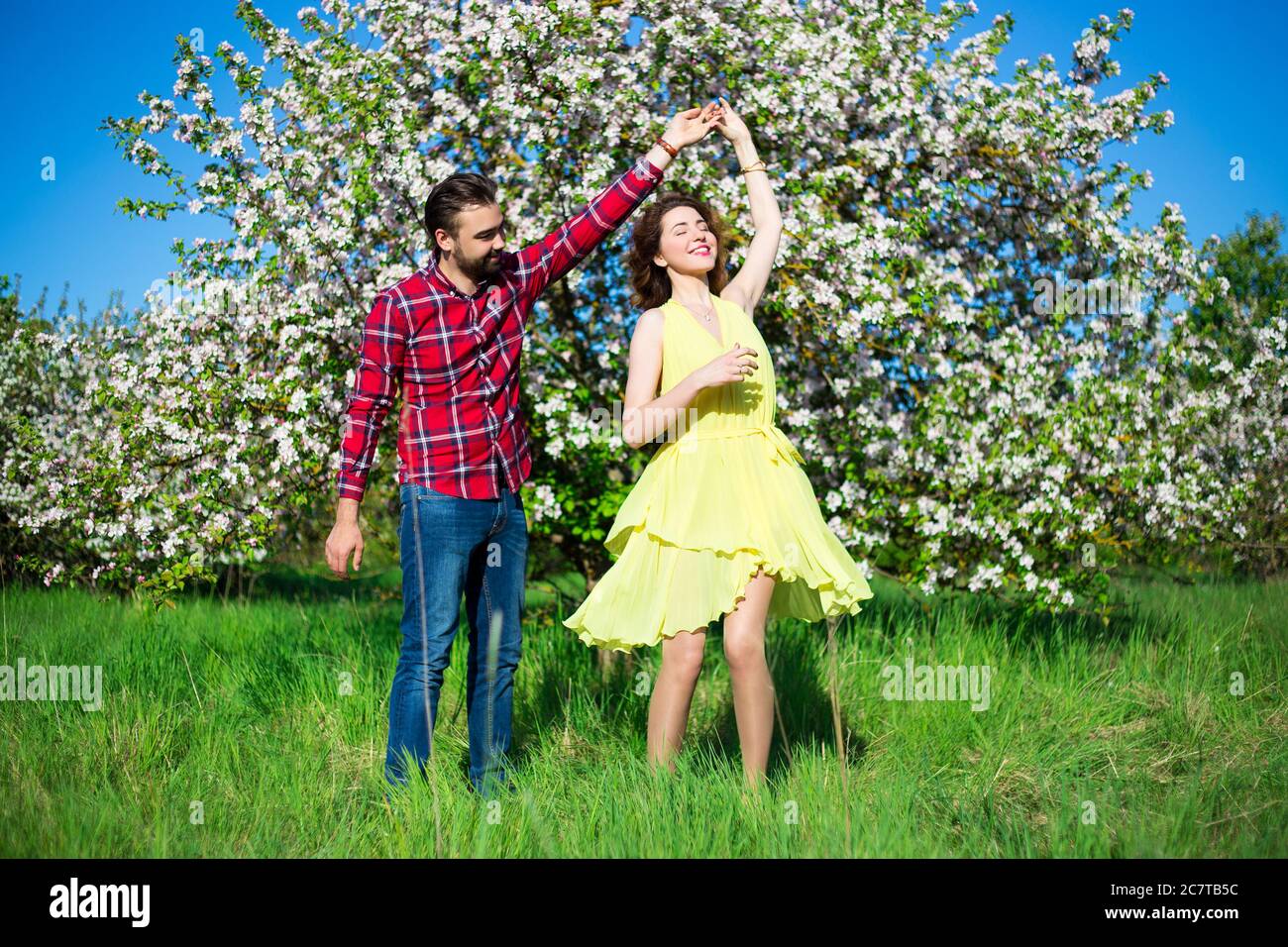 Couple kissing at blooming tree hi-res stock photography and images - Alamy