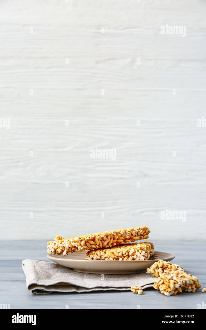 Plate with crispy rice bars on table Stock Photo