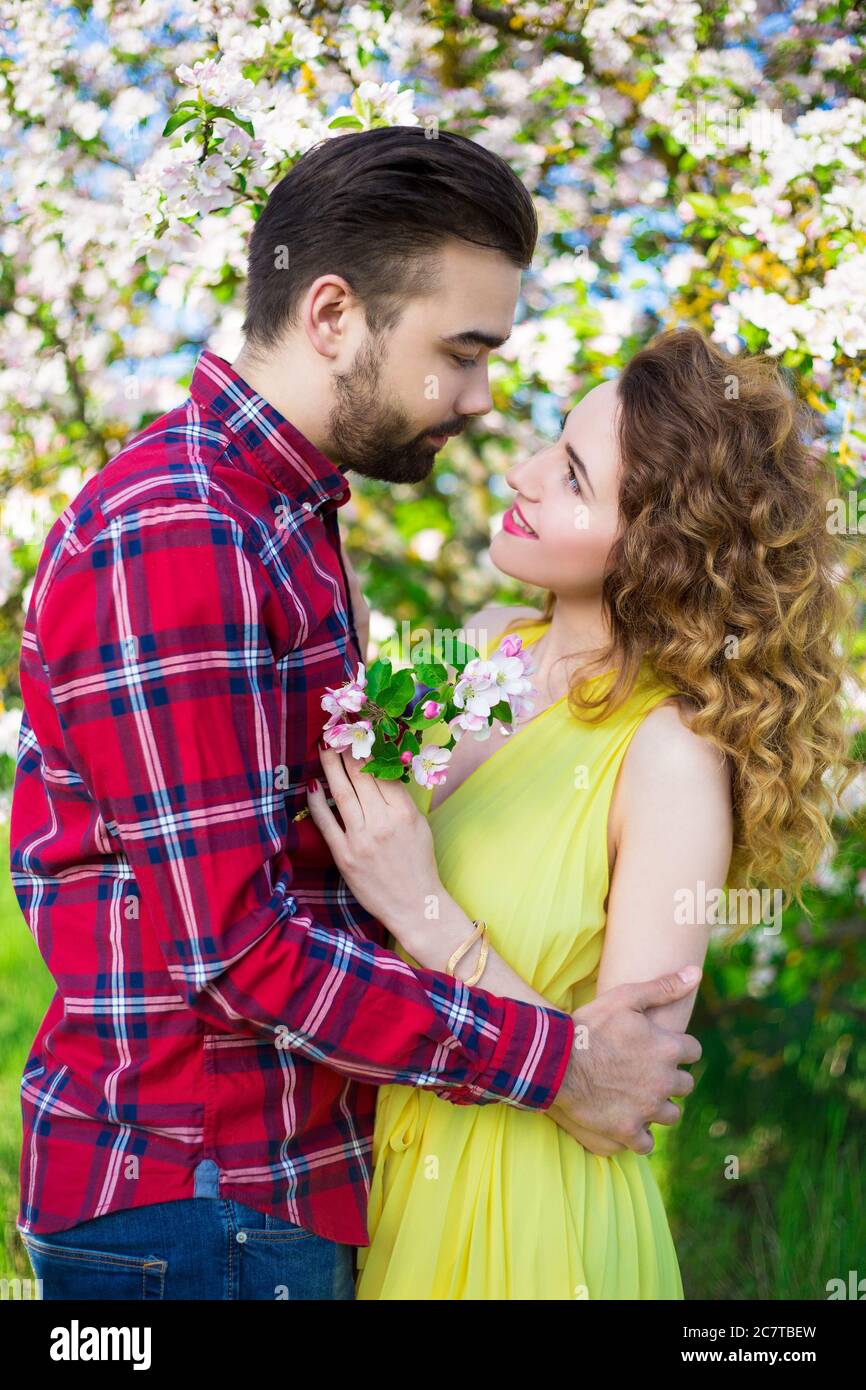 Couple kissing at blooming tree hi-res stock photography and images - Alamy