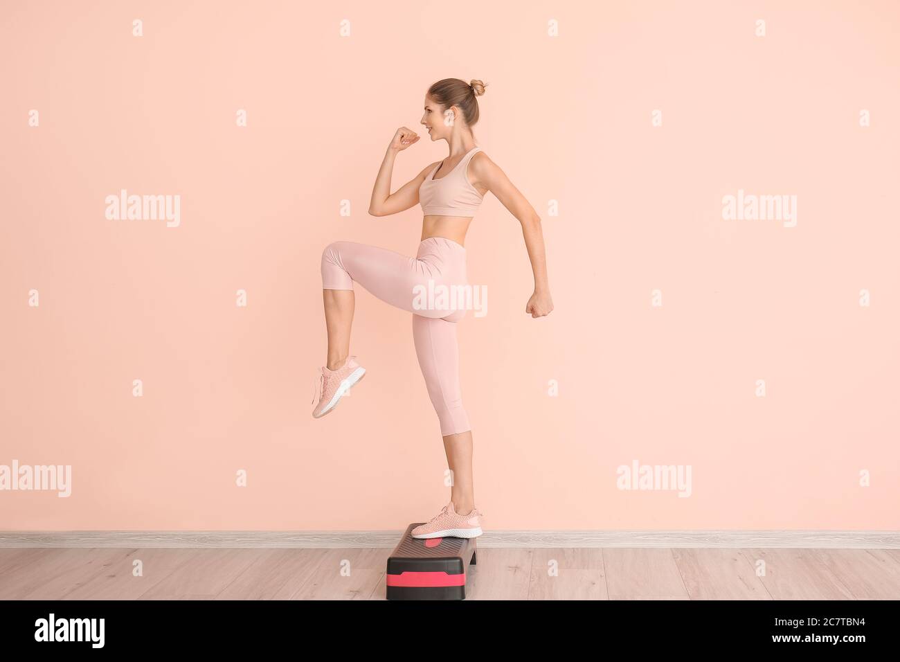 Sporty young woman training at home Stock Photo - Alamy