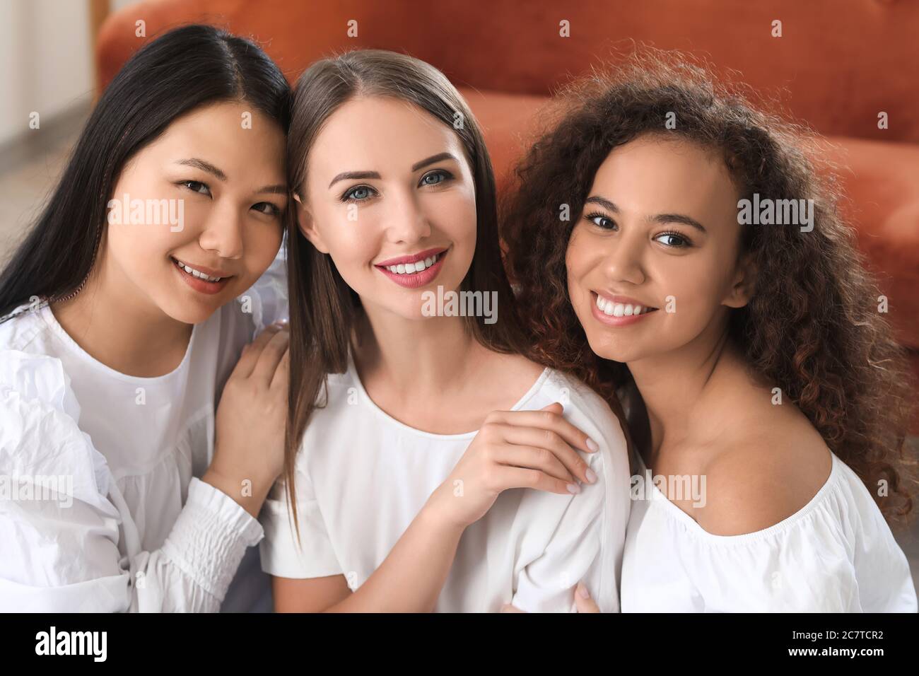 Women of different nationalities at home. Stop racism Stock Photo