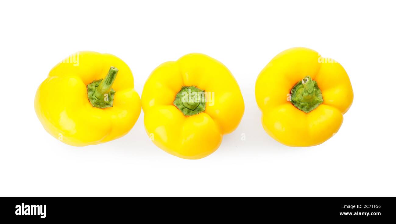 Yellow bell peppers on white background Stock Photo - Alamy