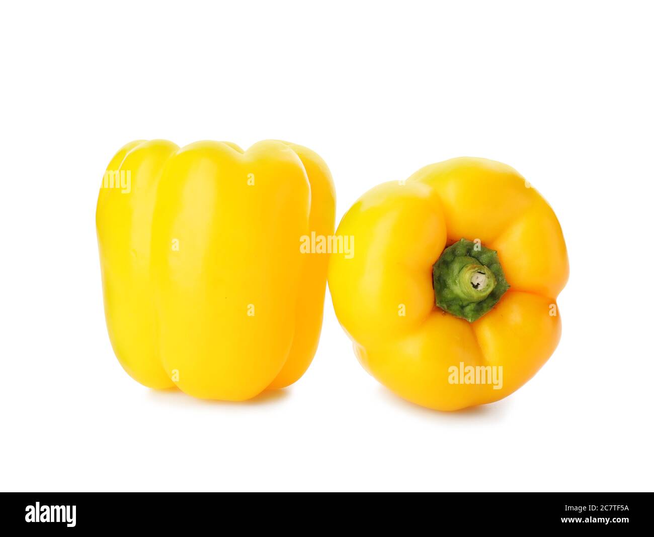 Yellow bell peppers on white background Stock Photo - Alamy