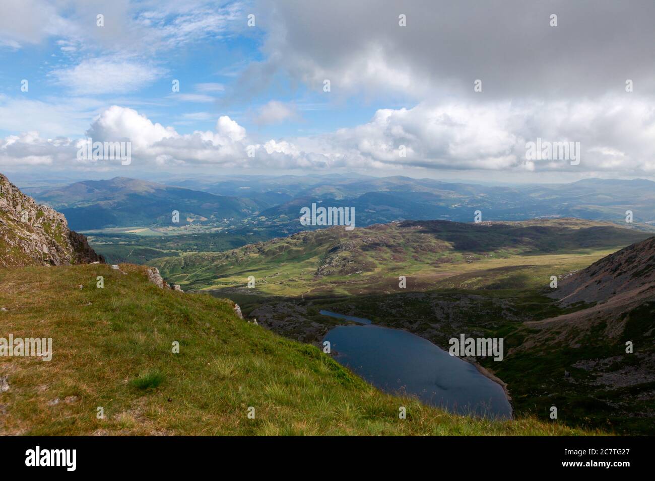 Summer view of Llyn y Gadair,and the hills and countryside around Dolgellau from the Pony Path ascending Cadair Idris Stock Photo