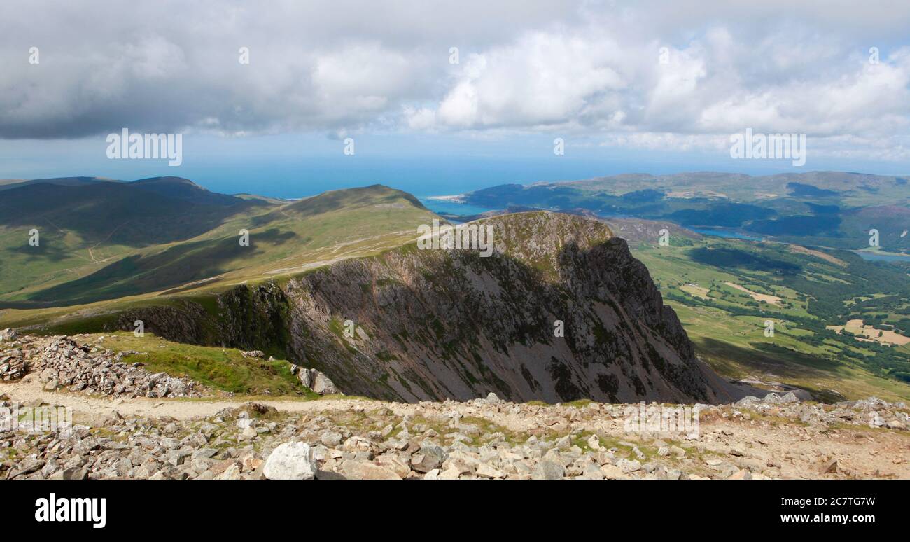 Summer view of Cyfrwy, Craig Las and the hills and countryside towards Barmouth from the Pony Path ascending Cadair Idris Stock Photo