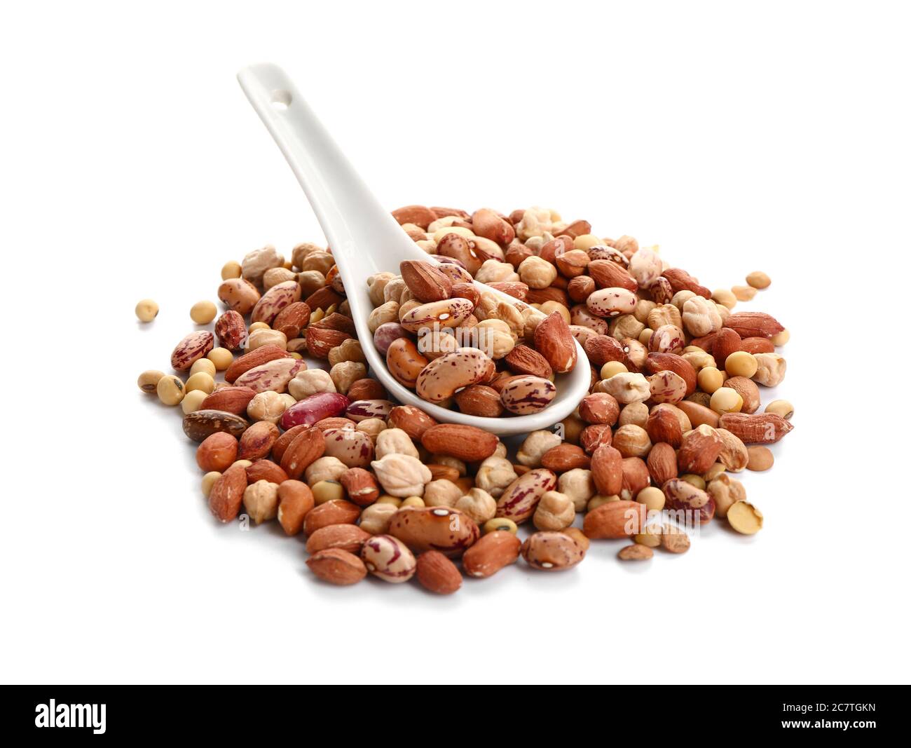 Spoon with raw legumes on white background Stock Photo